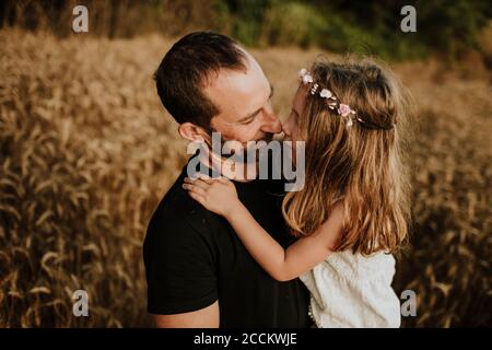 Father and daughter making wonderful memories together in wheat farm