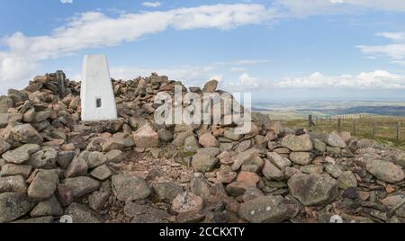 Hedgehope Hill summit trig point and wind shelter at the end of the walk from Breamish Valley, Northumberland National Park in August late summer. Stock Photo