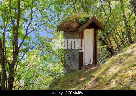 Small outside toilet house in the mountain of Geiranger Stock Photo