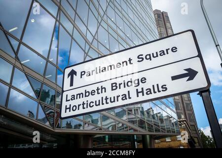 London- Road sign directions to Parliament Square and Lambeth Bridge in Westminster Stock Photo