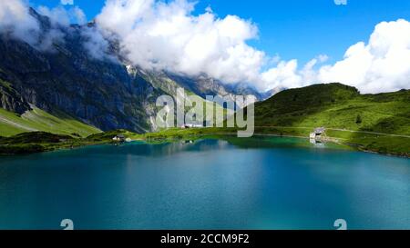 Flight over a wonderful mountain lake in the Swiss Alps - Lake Truebsee on Mount Titlis Stock Photo