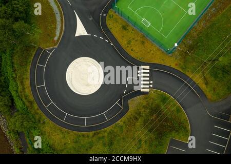 Aerial view of road markings at a roundabout / parking area near sports complex in Portree, Isle of Skye, Scotland. Stock Photo