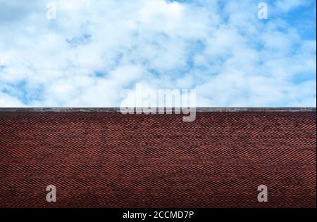 old asian temple roof tiles design and dark cloudy sky background Stock Photo