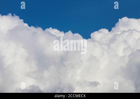 White cumulus clouds on a blue sky background Stock Photo