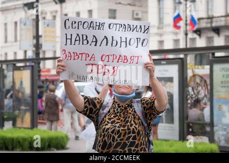 Saint Petersburg, Russia - August 22, 2020: a protester holds a poster saying in Russian 'Today they poisoned Navalny, tomorrow they will poison you'. Stock Photo