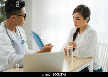 Japanese Gynecologist With Patient In Exam Room Stock Photo Alamy   Young Male Obstetrician Gynecologist Consulting With Patient In Clinic Or Hospital 2ccmewj 