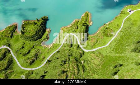 Flight over a wonderful mountain lake in the Swiss Alps - Lake Truebsee on Mount Titlis Stock Photo