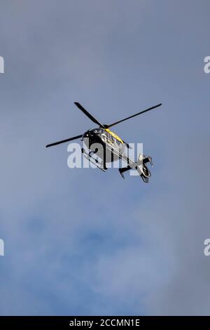 West Yorkshire EC35 Police Helicopter Registration mark GPOLB flying above Kirkheaton village, Huddersfield - National Police Air Service Stock Photo