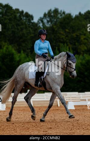 Raeford, North Carolina, USA. 22nd Aug, 2020. Aug. 22, 2020 - Raeford, North Carolina, USA - ANDI LAWRENCE riding Cooley Northern Mist competes in dressage at the 2020 War Horse Event Series, Aug. 22 at Carolina Horse Park in Raeford, N.C. Founded in 2013 as the Cabin Branch Event Series, the War Horse Event Series consists of five horse trials and combined tests and attracts riders and their horses from across the eastern United States. Credit: Timothy L. Hale/ZUMA Wire/Alamy Live News Stock Photo