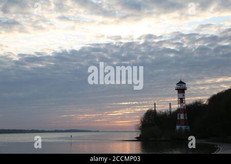 Lighthouse at Hamburg Wittenbergen, Sunset at the Elbe River near Hamburg Stock Photo