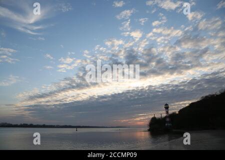 Lighthouse at Hamburg Wittenbergen, Sunset at the Elbe River near Hamburg Stock Photo