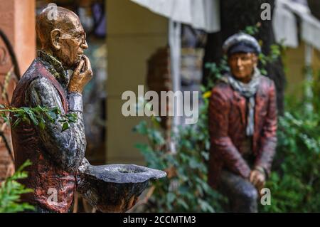 Odessa, Ukraine - 3, OCTOBER, 2010: Gipseous sculpture. Heroes of novel 'Twelve Chairs' by Ilf & Petrov. Deribasovskaya street. City garden. Stock Photo