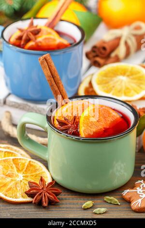 Traditional hot winter tea (compote) with cranberries, citrus fruits (orange or Mandarin), cinnamon, honey, cardamom and star anise. Warm drink. Punch Stock Photo