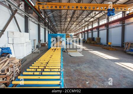 Metal work profiling factory interior inside. Machine tool conveyor for roll forming. Stock Photo