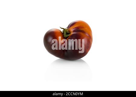 Tomato Kumato (Black Goddess) isolated on white background Stock Photo