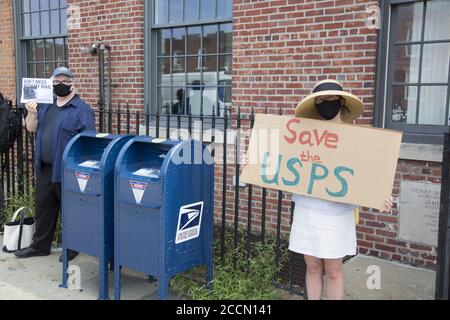 'Save The Post Office Saturday:' Protesters gather in front of nearly 800 Post offices around the country, like this one in the Kensington neighborhood, Brooklyn, to  support postal workers, demand government funding for the USPS, also demanding the resignation of Postmaster General Louis DeJoy and stop the voter suppression campaign orchestrated by the Trump administration by suppressing mail in voting. Stock Photo