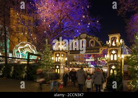 Night scenery, beautiful arched entrance of Weihnachtsmarkt, Christmas Market in Köln, at Alter Markt, famous marketplace nearby Cologne city hall. Stock Photo