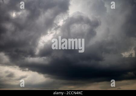 Dramatic sky with stratocumulus clouds, occasionally called a cumulostratus. Leaden sky covered with cumulus clouds Stock Photo