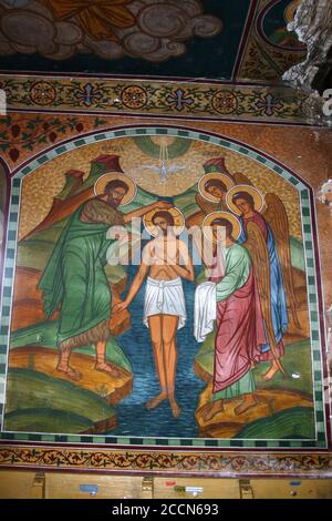 The baptism of Jesus Christ- fresco inside the Orthodox church in Pestera, Brasov County, Romania. Stock Photo
