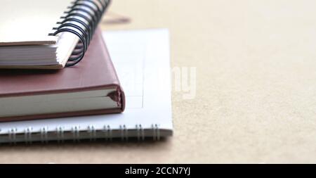 Notebooks and calendar on table. Selective focus. Copy space. Stock Photo