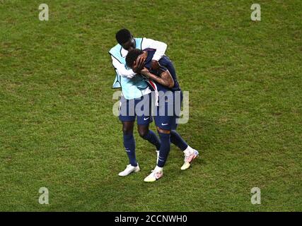 Lisbon, Portugal. 23rd Aug, 2020. Neymar (R) of Paris Saint-Germain is consoled by his teammate Idrissa Gueye following the UEFA Champions League Final match between Paris Saint-Germain and Bayern Munich at Estadio do Sport Lisboa e Benfica in Lisbon, Portugal, Aug. 23, 2020. Credit: Laurence Griffiths /UEFA via Xinhua/Alamy Live News Stock Photo