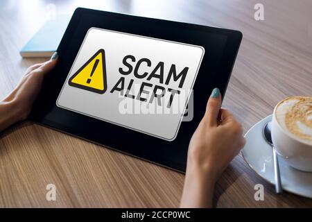 Scam alert detecting warning. Notification on device screen Stock Photo