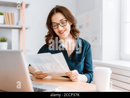 Happy casual beautiful woman working in home office Stock Photo - Alamy