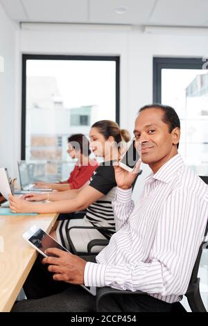 Smiling Indian businessman Stock Photo