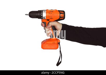 Hand holding cordless drill orange isolated on white background. tightening the screws. screw gun Stock Photo