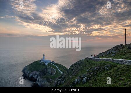 Sunset over South Stack lighthouse, Anglesey, North Wales Stock Photo