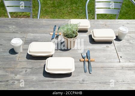 Takeout Lunch on the Table in Terrace Stock Photo