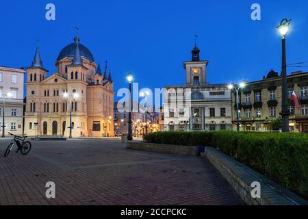 City of Lodz in Poland at night, Pentecost of the Holy Spirit Church and Town Hall building on Freedom Square, (Liberty Square, Plac Wolnosci). Stock Photo