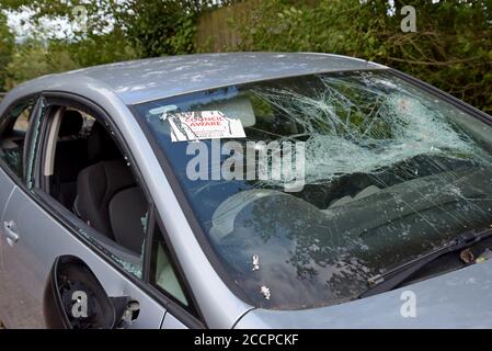 A 2009 Seat Ibiza vandalised and left in a Herefordshire layby on bricks with a 'council aware' sticker on the windscreen 22nd August 2020 Stock Photo
