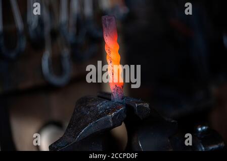 Close up of hot iron in blacksmith's workshop Stock Photo