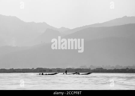 Lifestyle in Lake Inle with his famous leg-rowing  fishermans taken in black and white Stock Photo