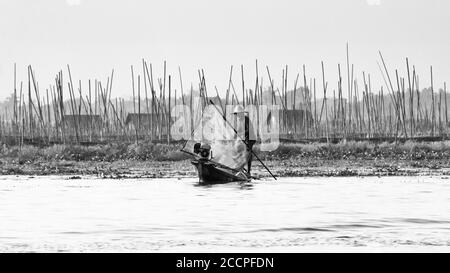 Lifestyle in Lake Inle with his famous leg-rowing  fishermans taken in black and white Stock Photo