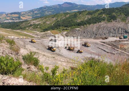 Excavators and vehicles working in a quarry Stock Photo