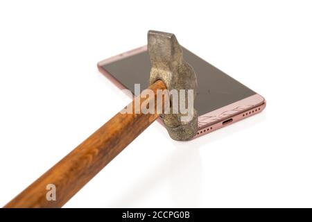 hammer smashes the phone hitting it in the corner isolated on white background Stock Photo