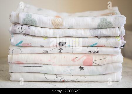 Fabric, textiles, clothing concepts. Multicolored muslin fabric on the table closeup Stock Photo