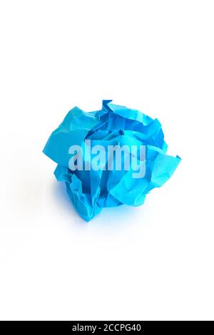 Crumpled blue paper isolated on white. Vertical Stock Photo