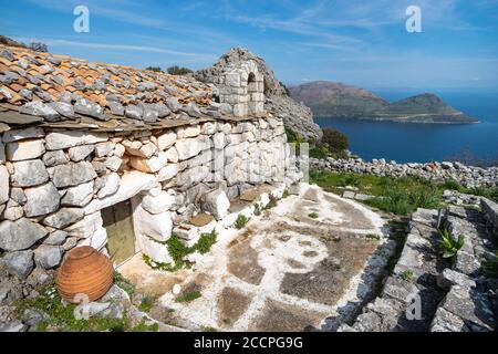 The Little church of Agios Georgos at the ancient megalithic settlement of Makrynaros on the eastern coast of the Deep Mani, overlooking the bay of Ko Stock Photo