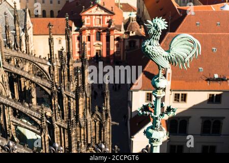 Cockerel detail on the roof of St Vitus Cathedral and topshot view over Prague Castle ( Prazsky Hrad)  Hradcany,  Prague. Czech Republic Stock Photo
