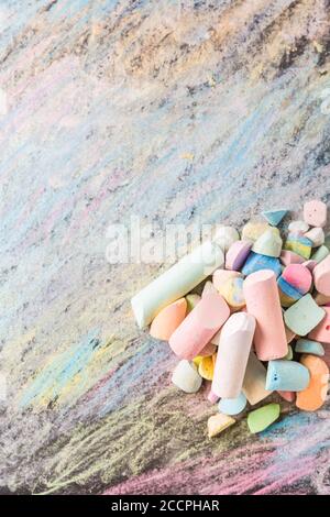 Chalks with colorful painted background. Back to school and art concept with copy space. Stock Photo