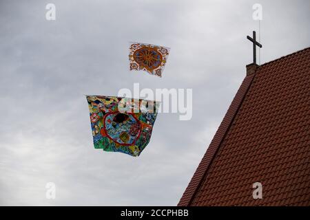 Various kites flying in the blue sky at the kite festival, Zapyskis, Lithuania Stock Photo