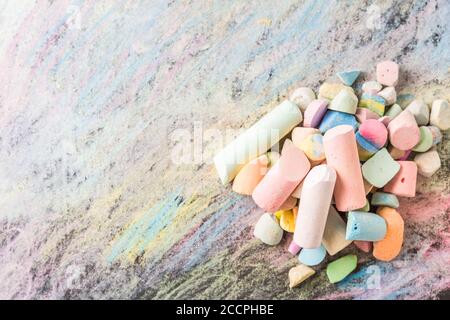 Chalks with colorful painted background. Back to school and art concept with copy space. Stock Photo