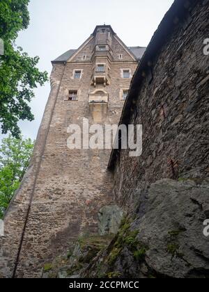 Czocha, Poland-July 22, 2019: Close and upward view on Czocha Castle from the outside of defensive walls. Thirteenth-century defensive castle, stone a Stock Photo
