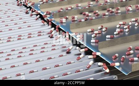 pharmacy medicine capsule pill in production line at medical factory Stock Photo