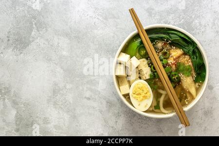 Traditional asian noodle soup Udon. Vegetarian recipe. Stock Photo