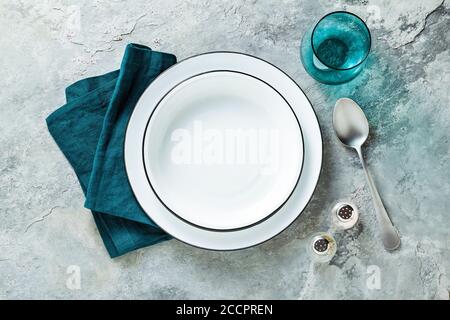table setting with set of empty plates on stone background Stock Photo