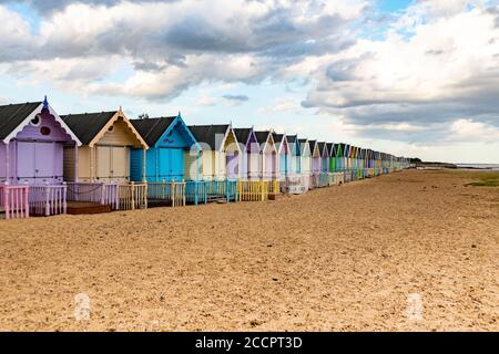 Beach huts on West Mersea beach .   West Mersea Beach, Mersea Island, Colchester, Essex. Stock Photo